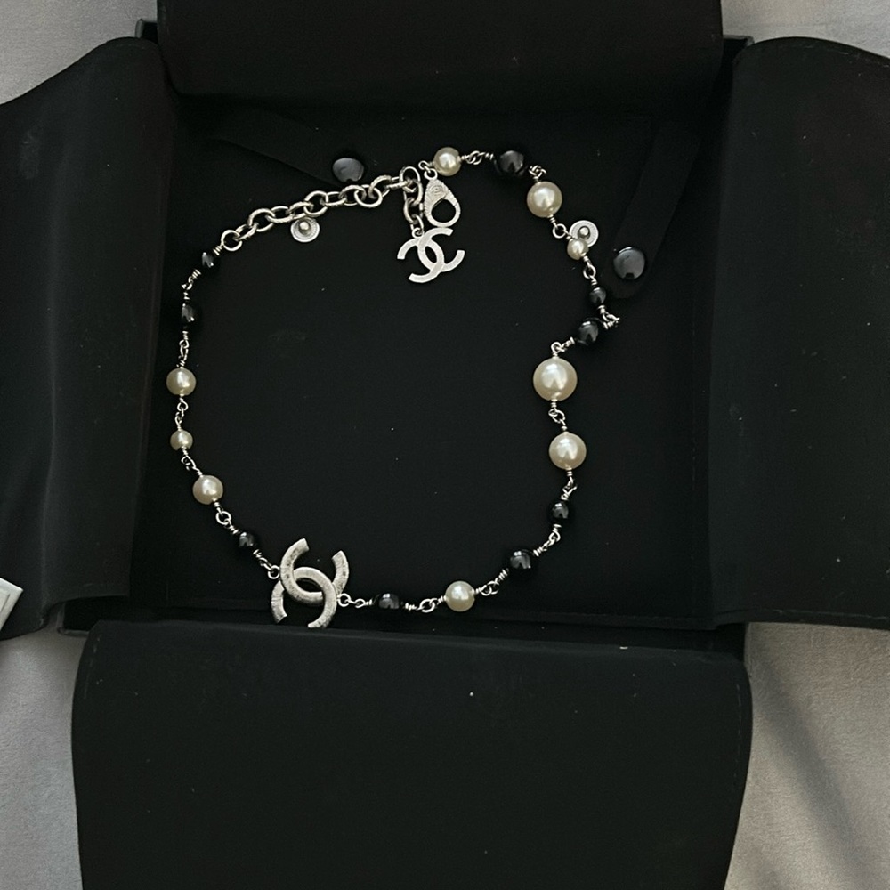 Nwt chanel cc necklace with white and black beads…silver. 19 inches